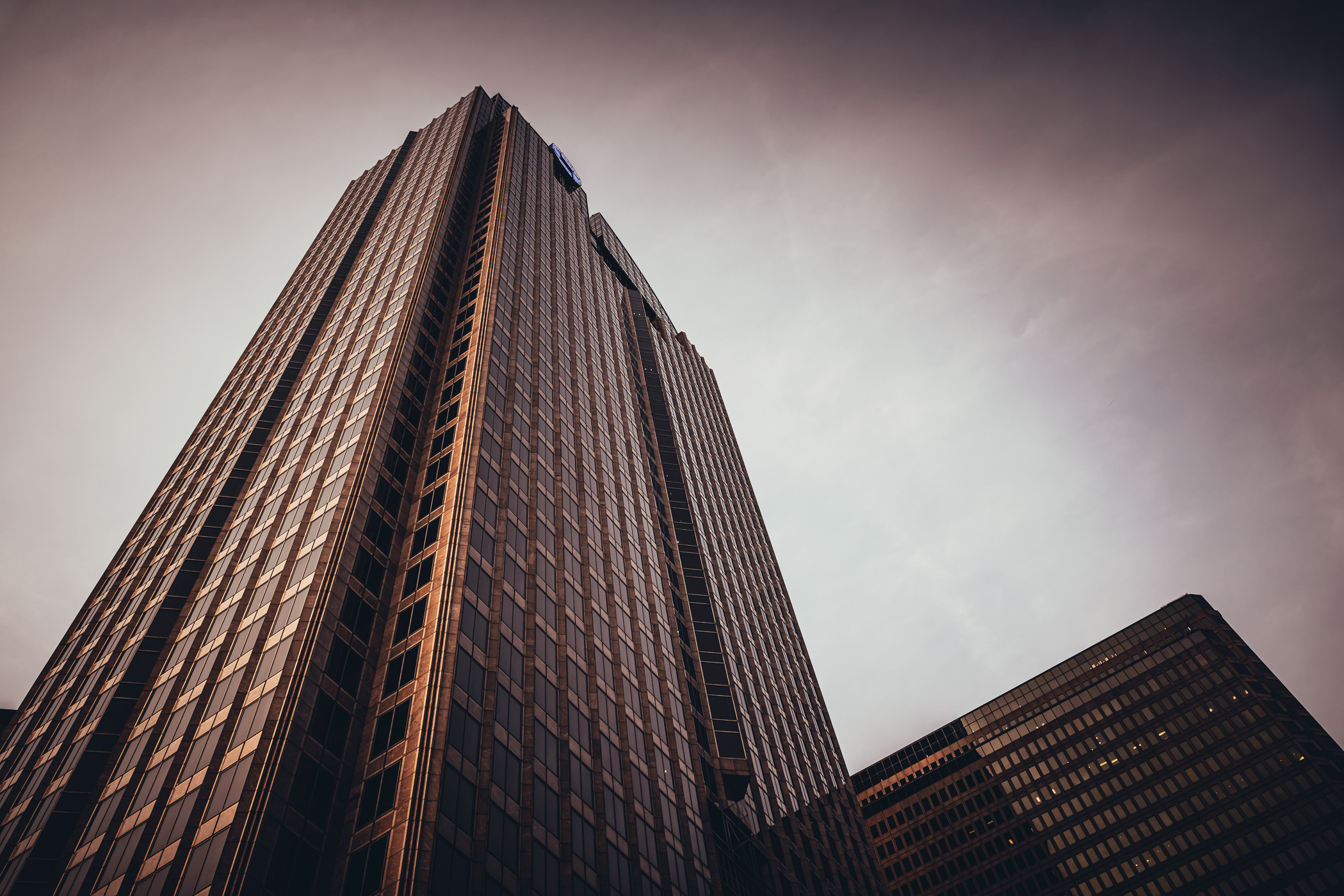 Downtown Dallas' Dallas Arts Tower (formerly Chase Tower) rises over the adjacent Plaza of the Americas.