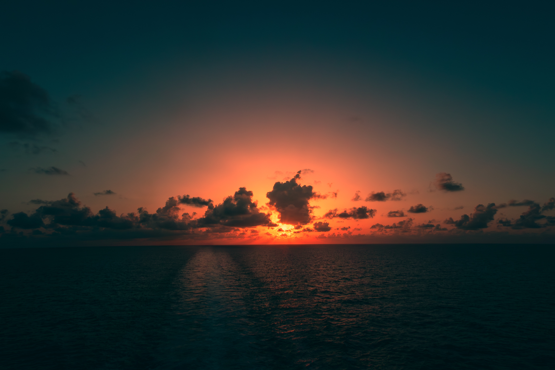 The sun sets on the Gulf of Mexico somewhere offshore of Galveston Island, Texas.