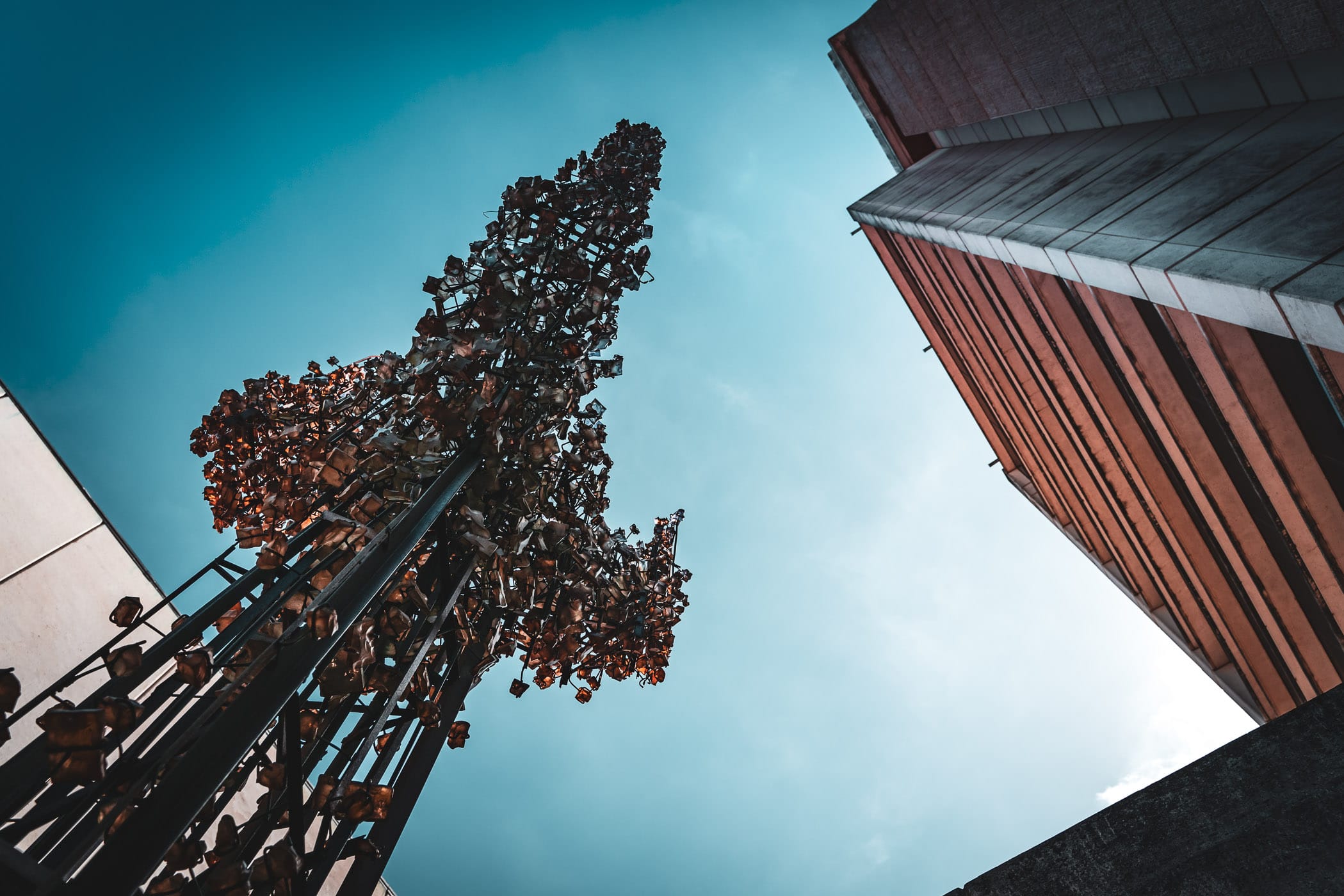 The 36-foot-tall sculpture “Tri-Nimbus Crystallis” by artists Hillard M. Stone and John Kebrle reaches towards the sky adjacent to Rudder Tower on the campus of Texas A&M University.