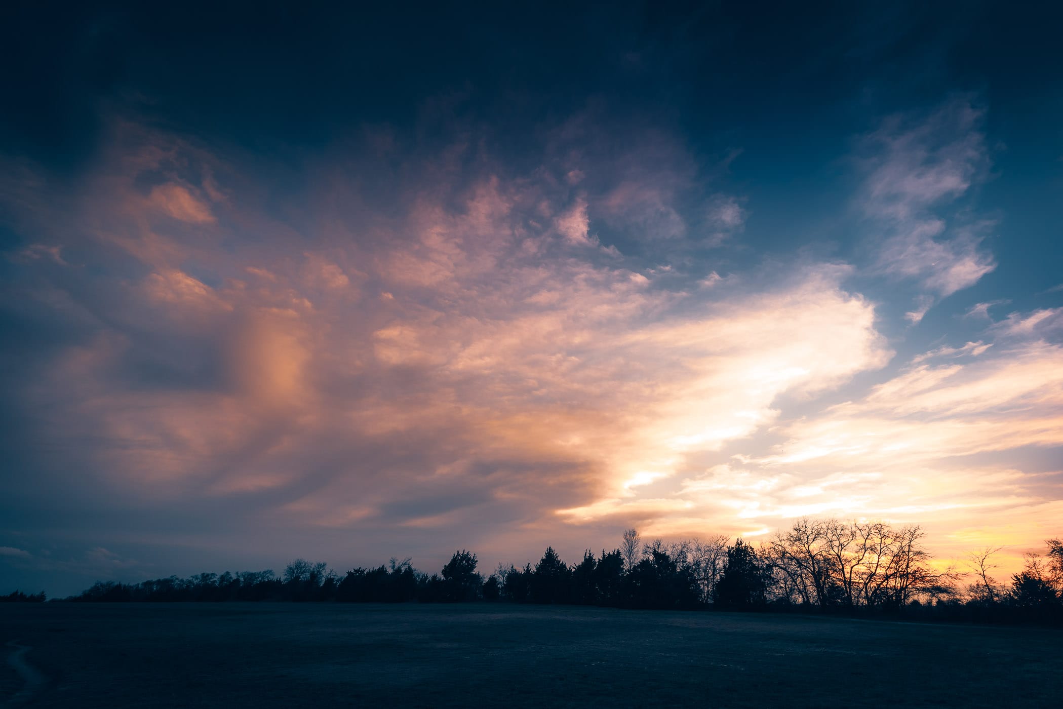 The sun sets over McKinney, Texas' Erwin Park.