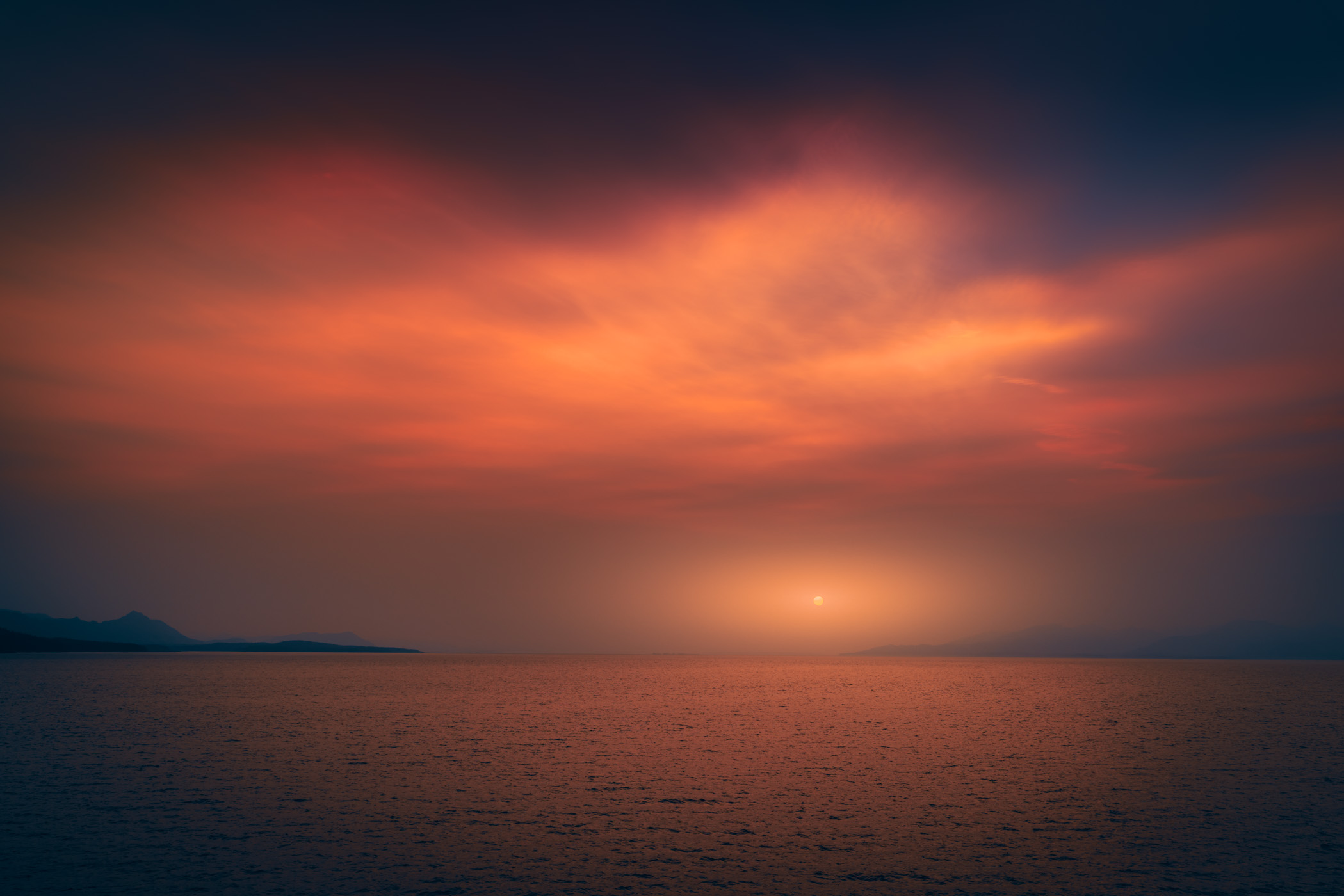 The sun sets on Stephens Passage, south of Juneau, Alaska.