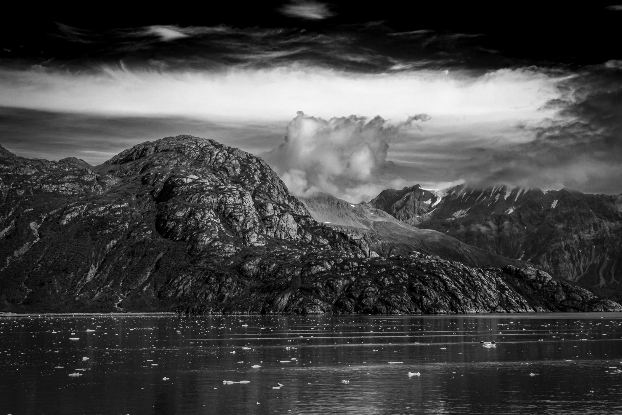 Mountains sprout from the shore of Alaska's Glacier Bay.