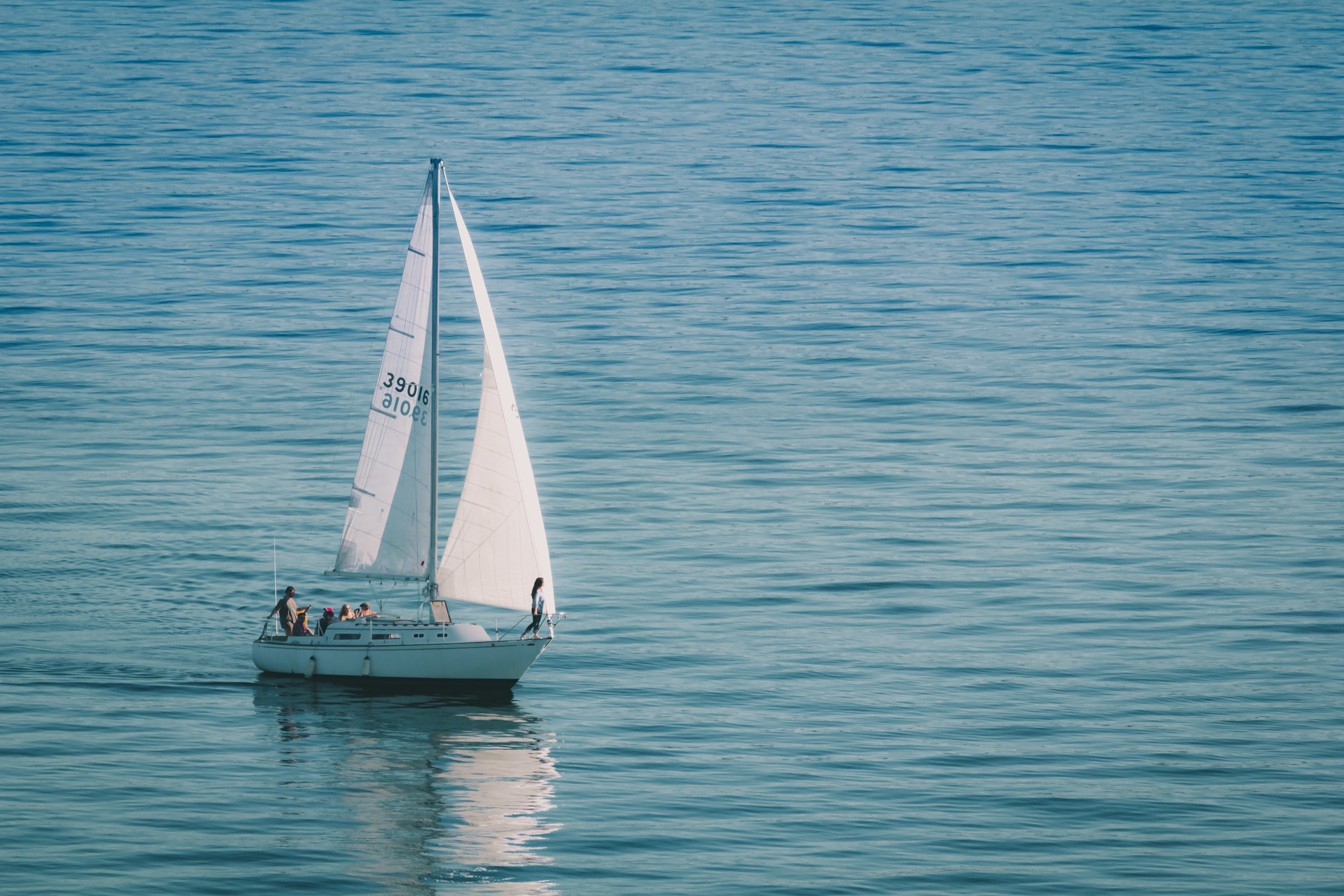 A sailboat sails the waters of the Salish Sea near Seattle, Washington.