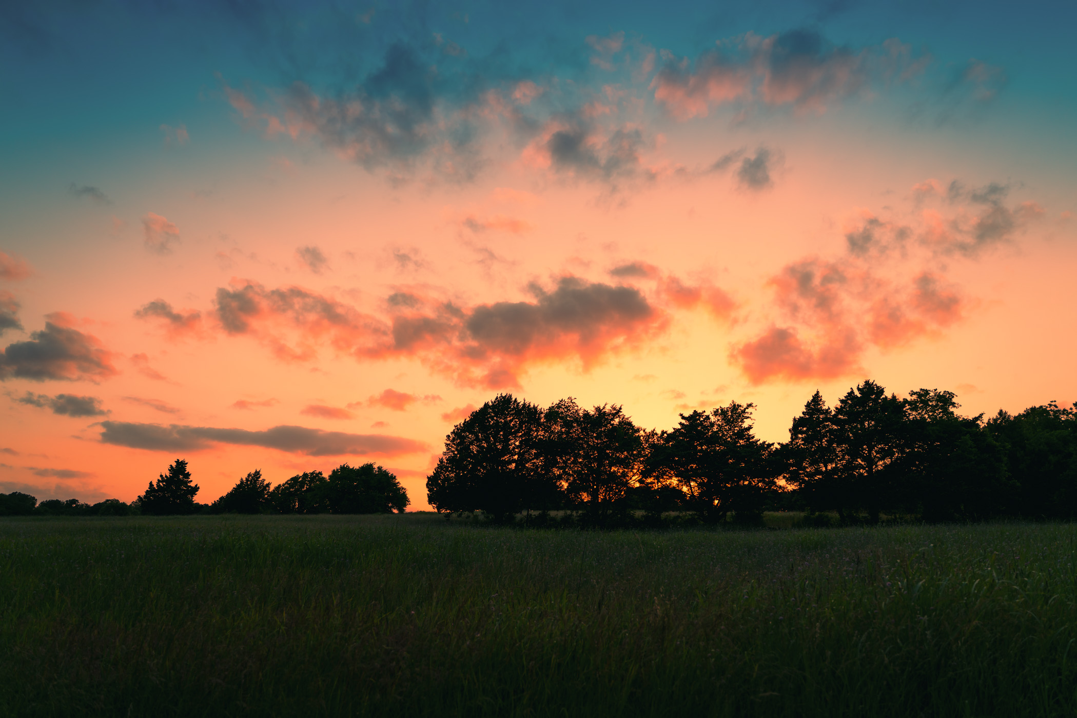 The sun sets on McKinney, Texas' Erwin Park.