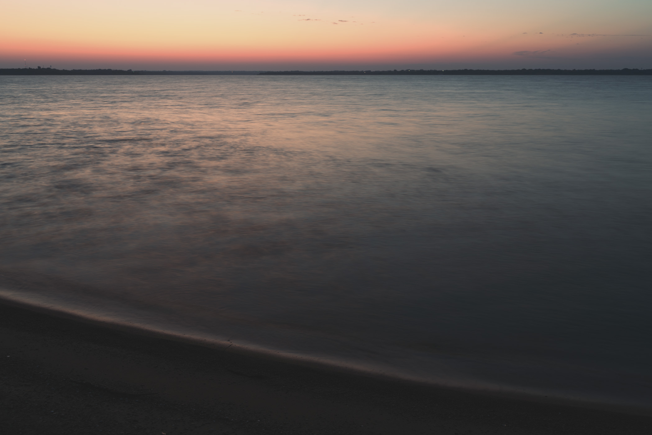 The sun begins to rise on North Texas' Lake Lavon.