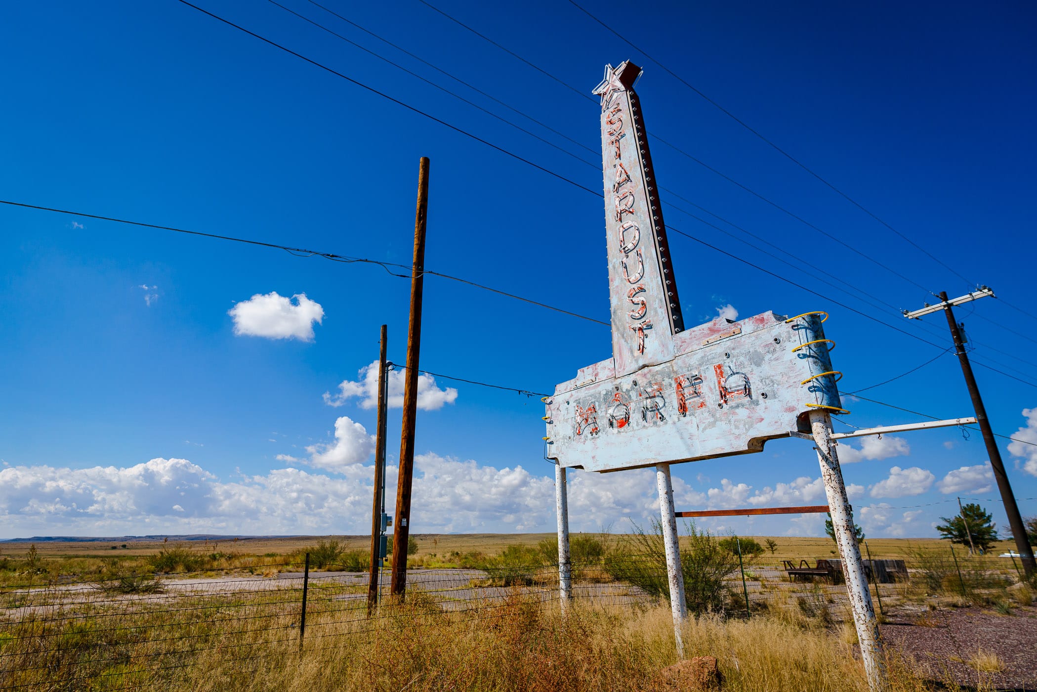 The abandoned, decaying sign of the long-demolished Stardust Motel in Marfa, Texas.