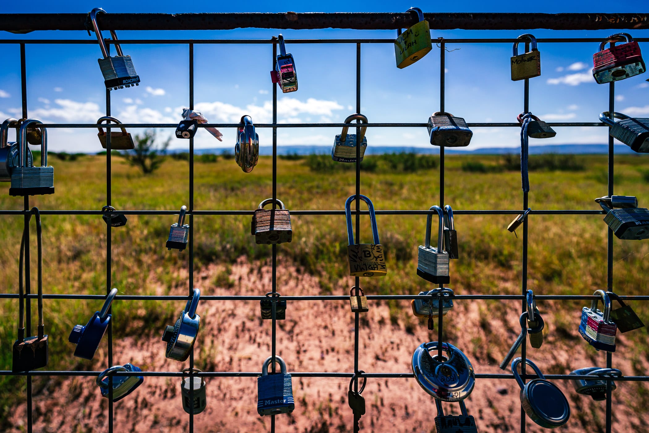 Love locks on a fence at the Prada Marfa art installation, Valentine, Texas.
