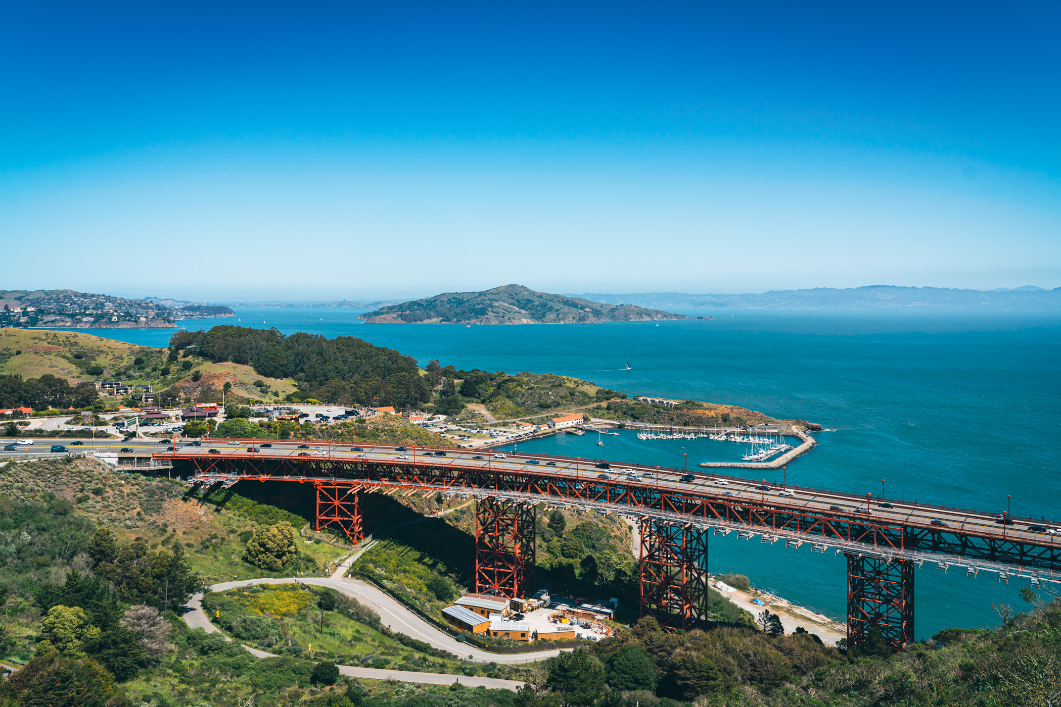 The northern approach of the Golden Gate Bridge vaults over the rugged landscape of the Marin Headlands.