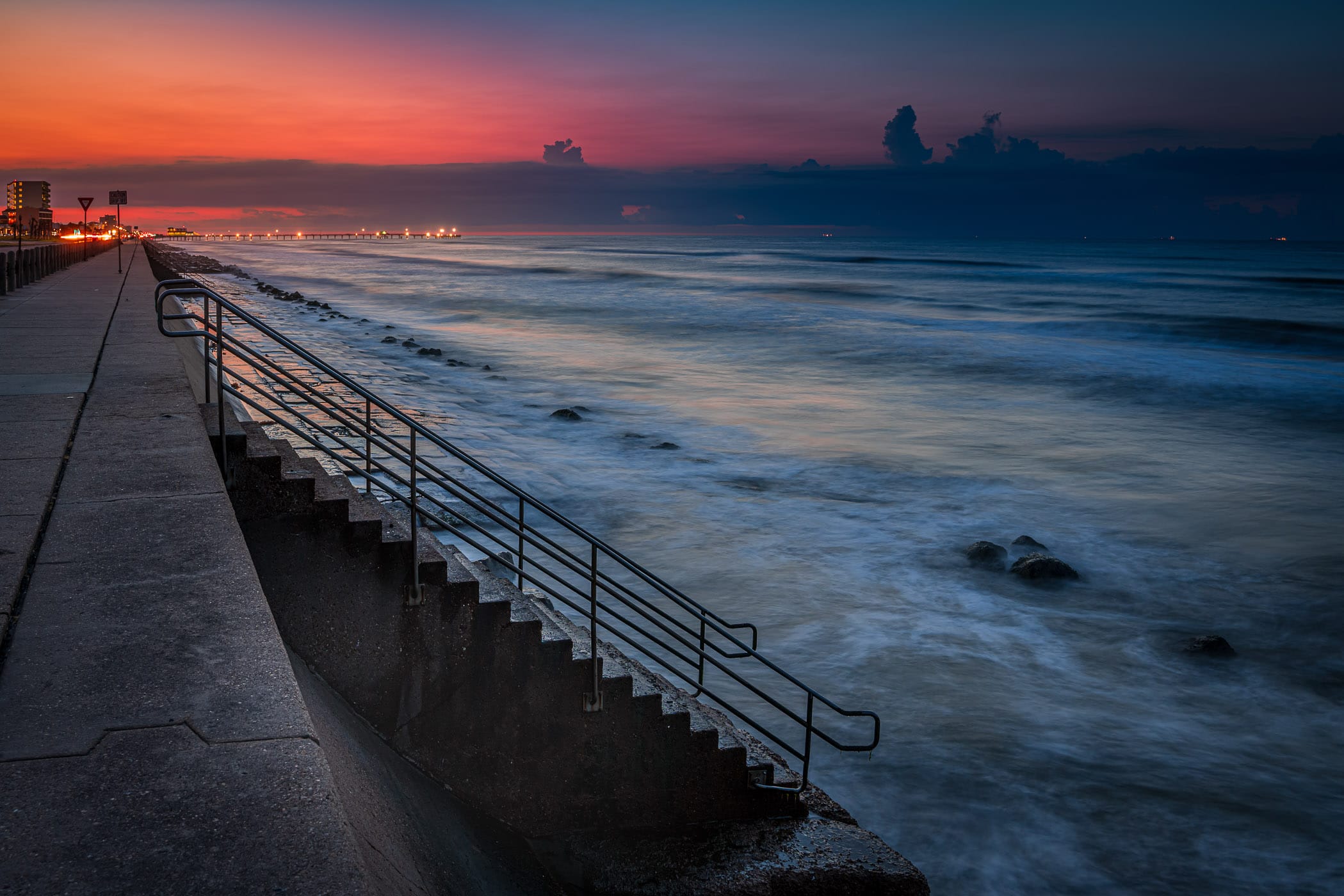 The first light of day on the Galveston, Texas, Seawall.