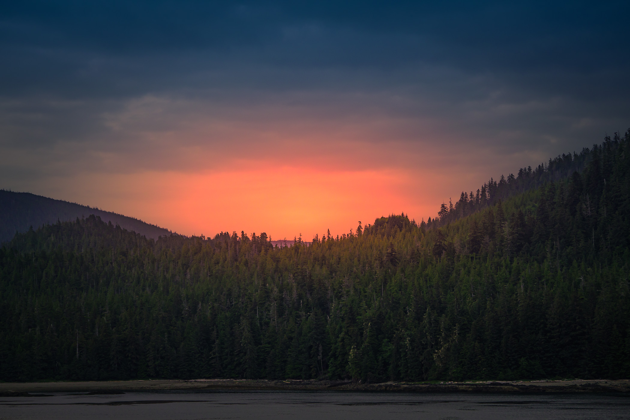 The sun sets on the far side of Gravina Island, near Ketchikan, Alaska.