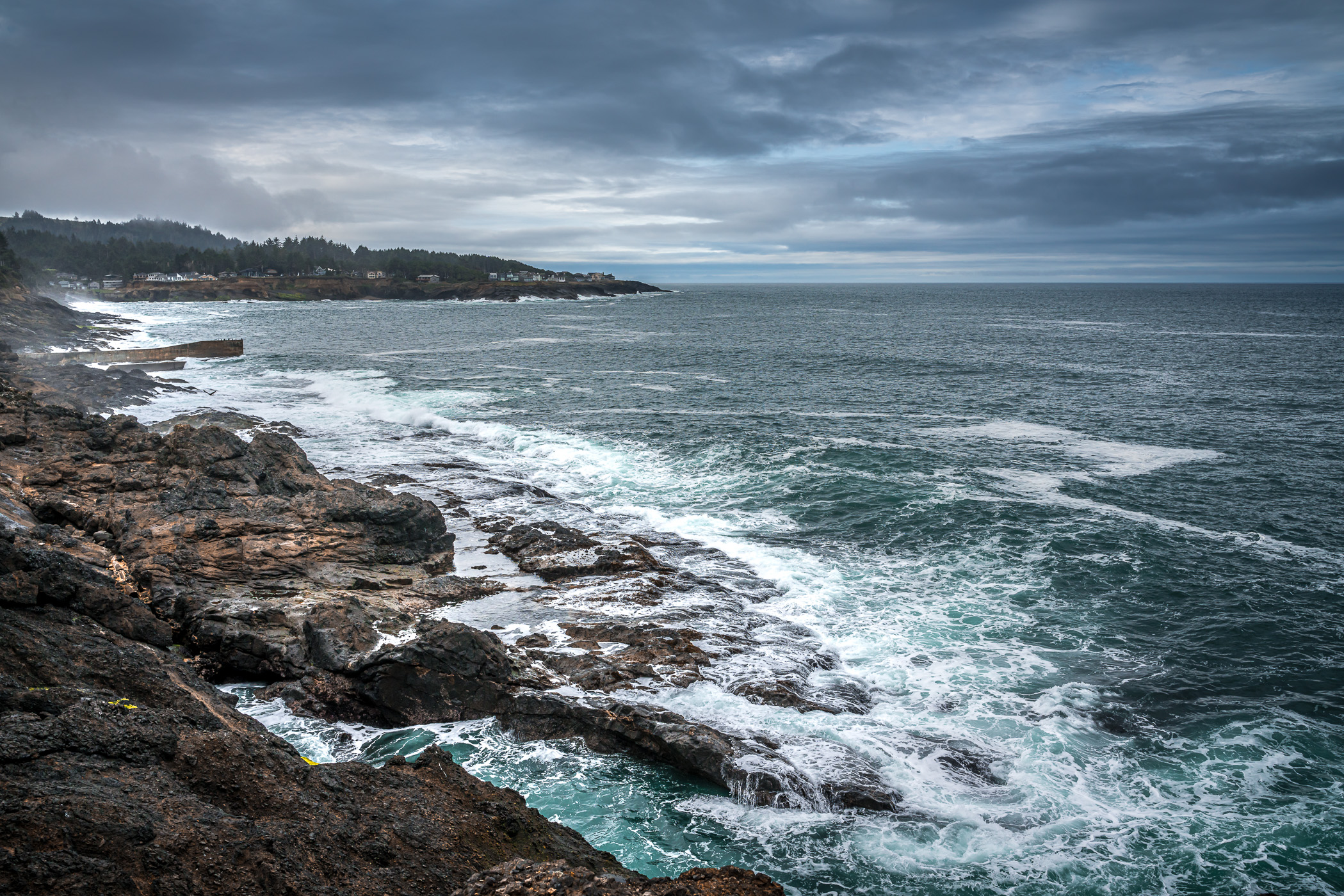 Waves crash on the rocky shore of Depoe Bay, Oregon.