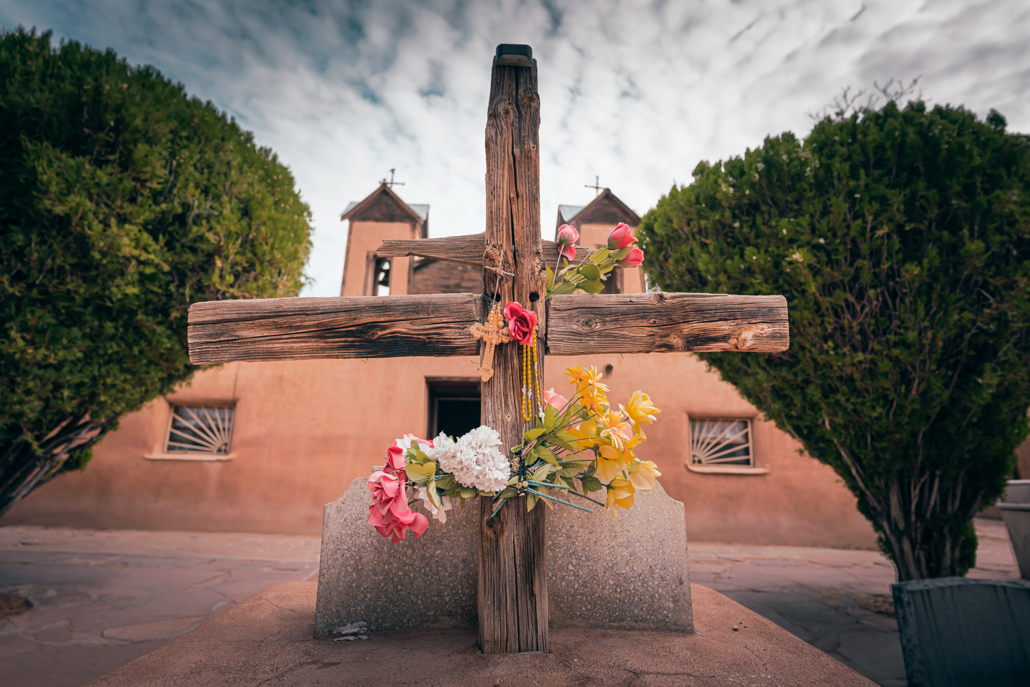 A wooden cross outside of the Santuario de Chimayó in Chimayó, New Mexico.