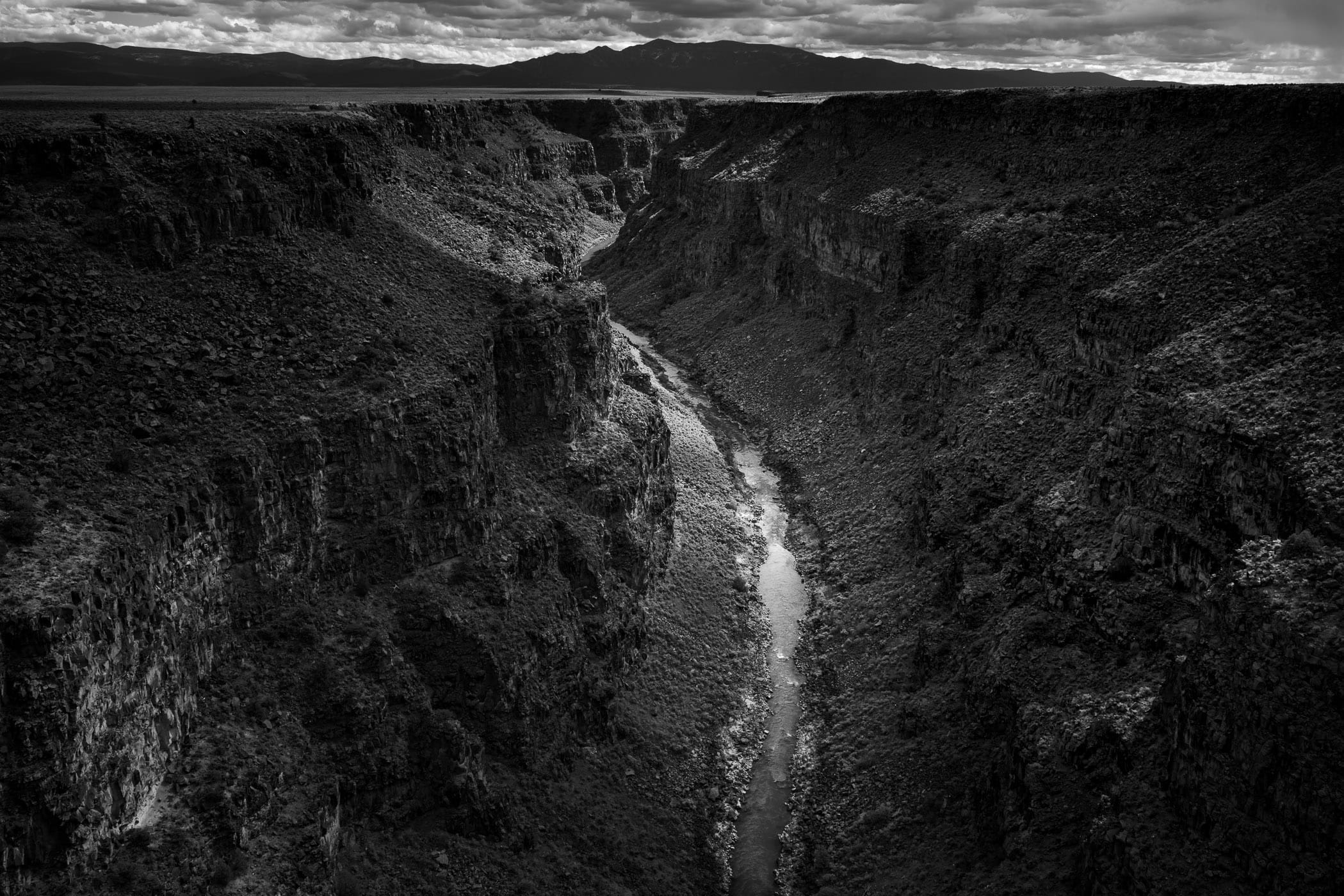 The Rio Grande flows through the desert at the Rio Grande Gorge near Taos, New Mexico,