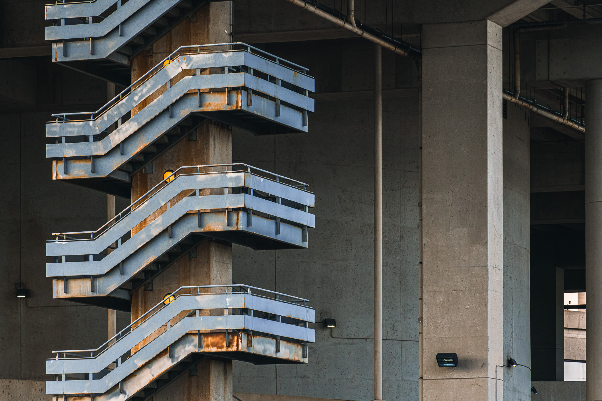 A abstract view of a staircase on the exterior of Downtown Dallas' Central Business District Vertiport.