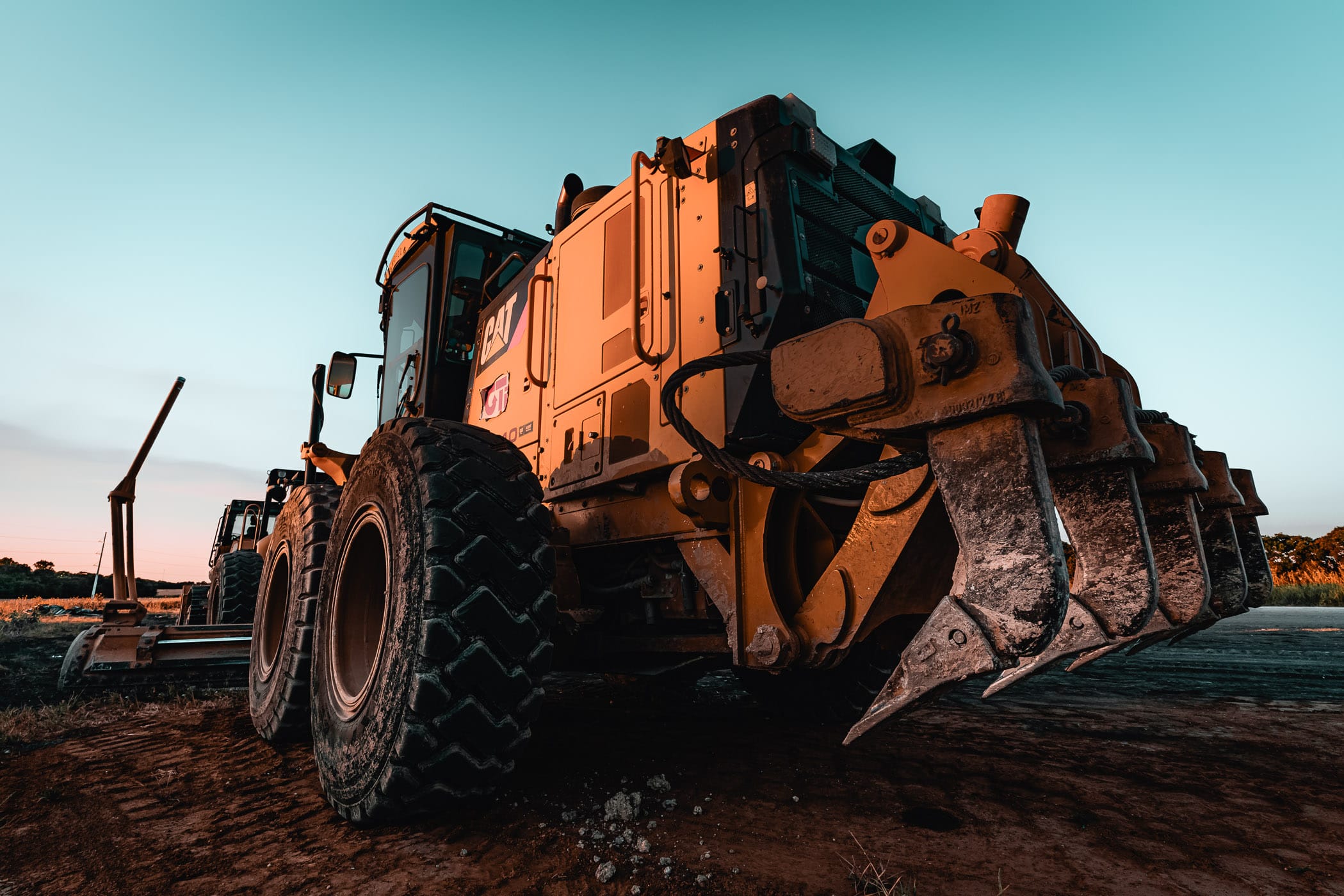 A piece of heavy construction equipment shows off its ripper blades at a construction site near Celina, Texas.