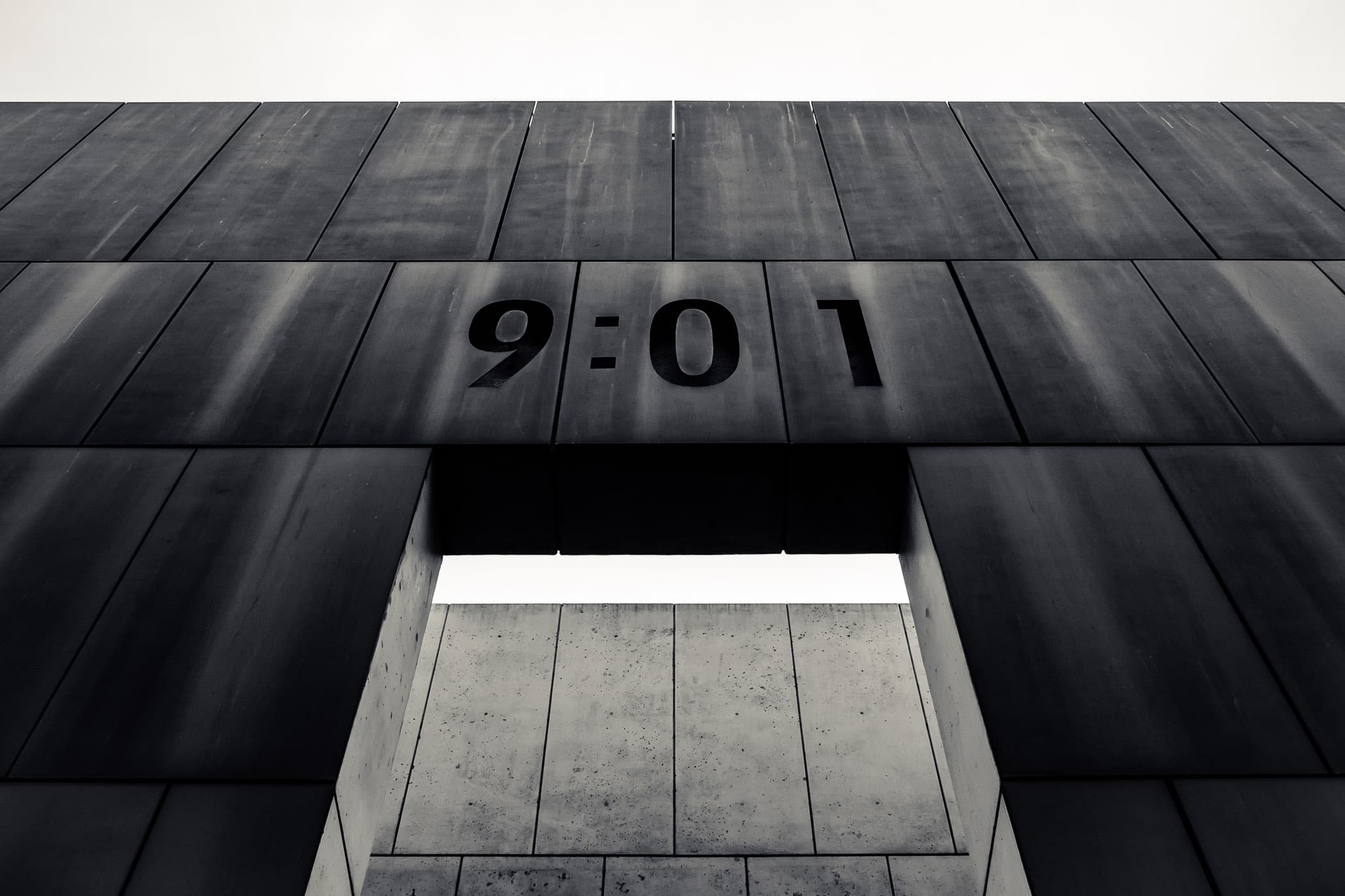 The eastern-most of the Gates of Time at the Oklahoma City National Memorial. Marked with the time 9:01 to signify the last minute of peace prior to the bombing of the Alfred P. Murrah Federal Building on April 19, 1995. A companion gate at the western end of the memorial is marked 9:03 to represent the first minute of recovery after the 9:02 AM explosion.