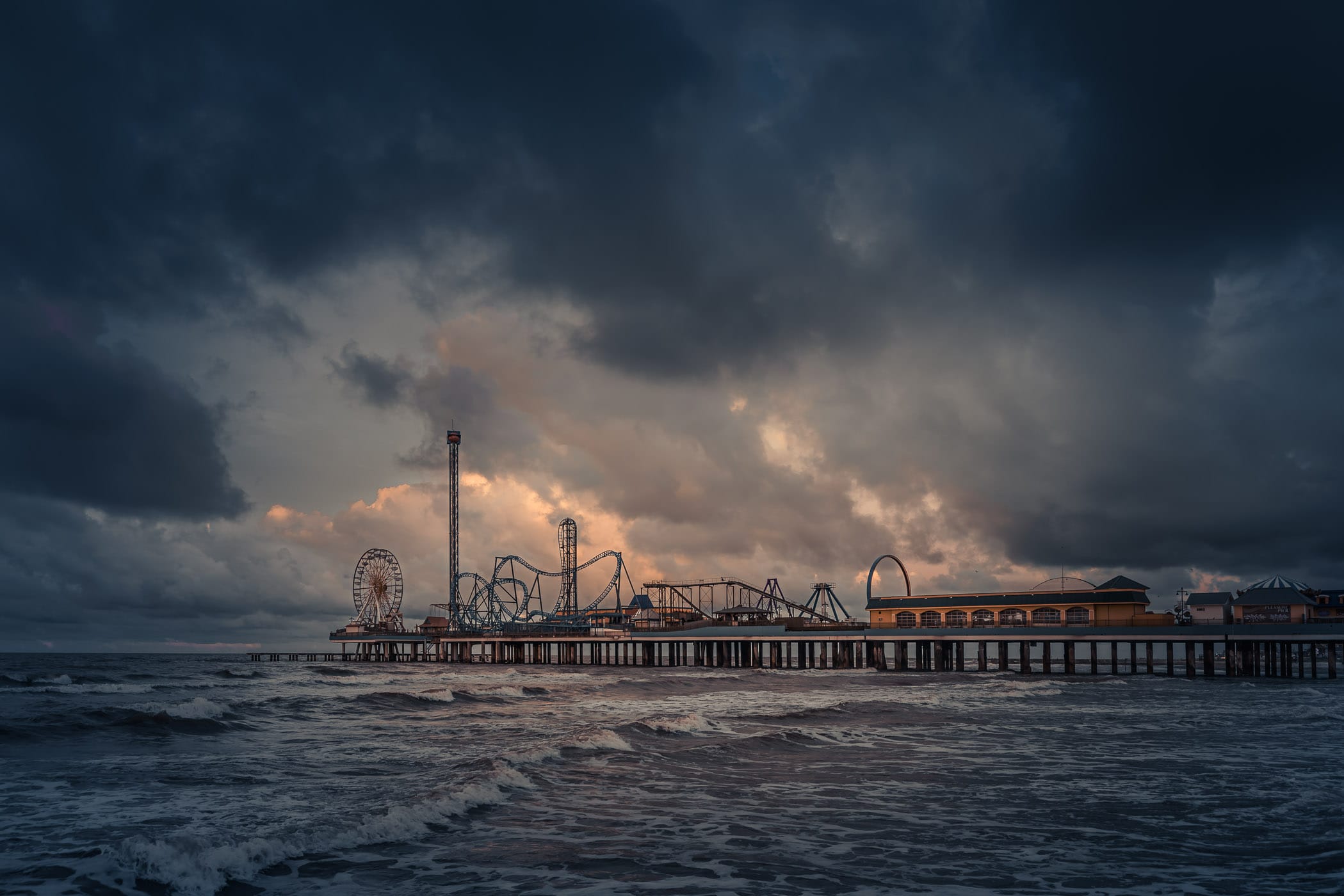 An offshore storm begins to roll in over the Galveston Island Historic Pleasure Pier, Galveston, Texas.