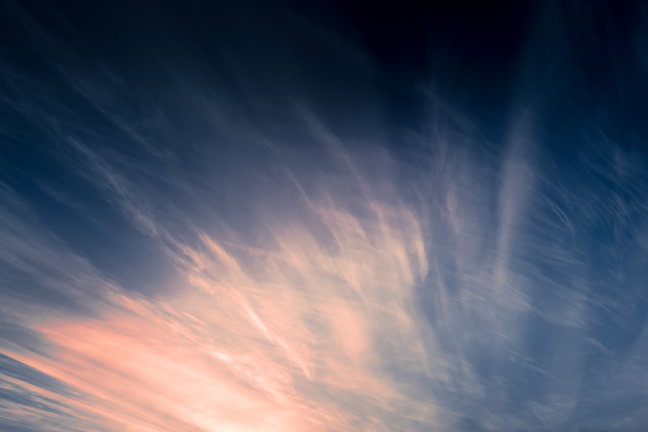 Late-evening clouds lit by the setting sun over McKinney, Texas.