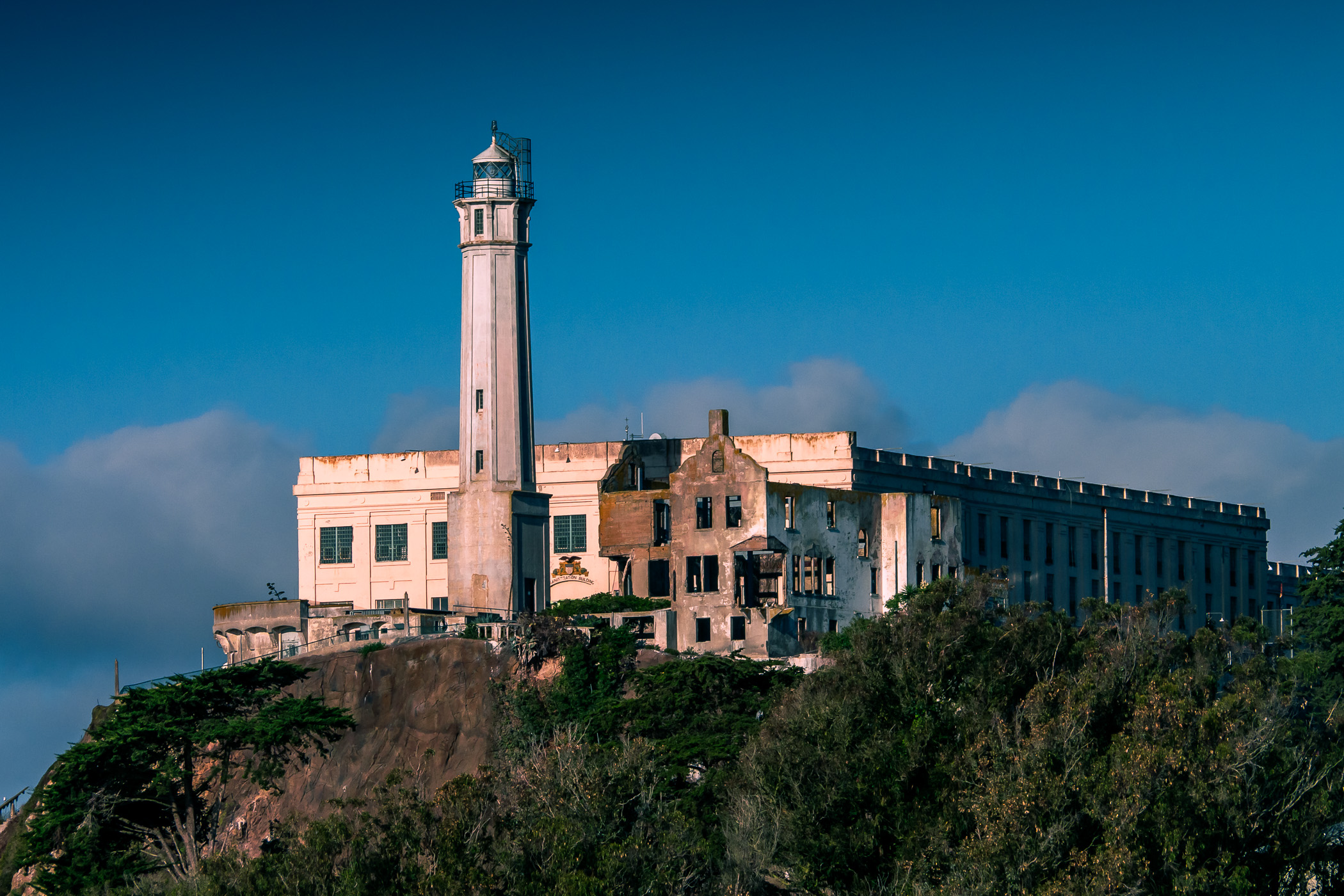 The morning sun illuminates the Alcatraz Federal Penitentiary in San Francisco Bay.