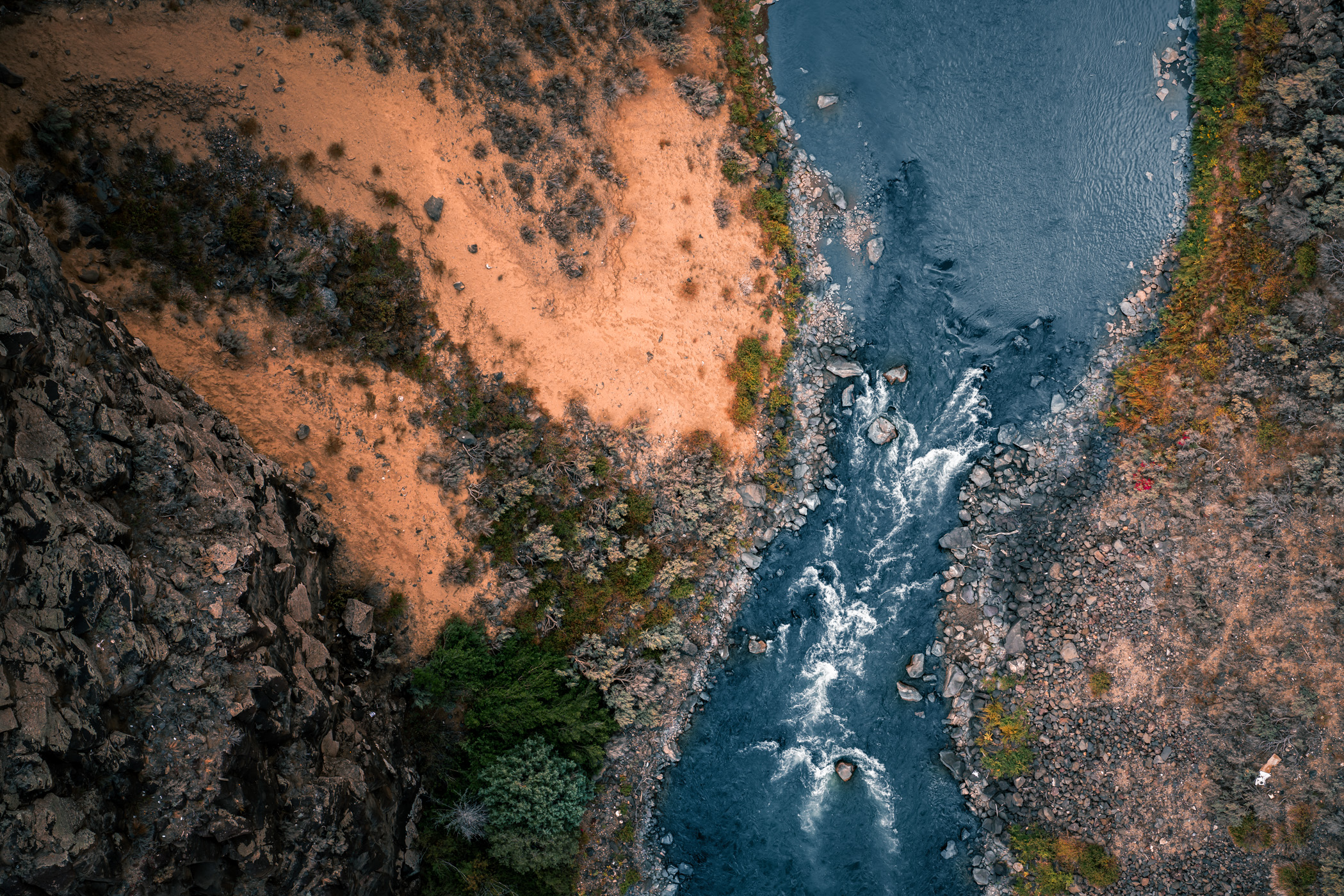 An aerial view of the Rio Grande as seen from the deck of the Rio Grande Gorge Bridge roughly 200m (650 feet) above, near Taos, New Mexico.