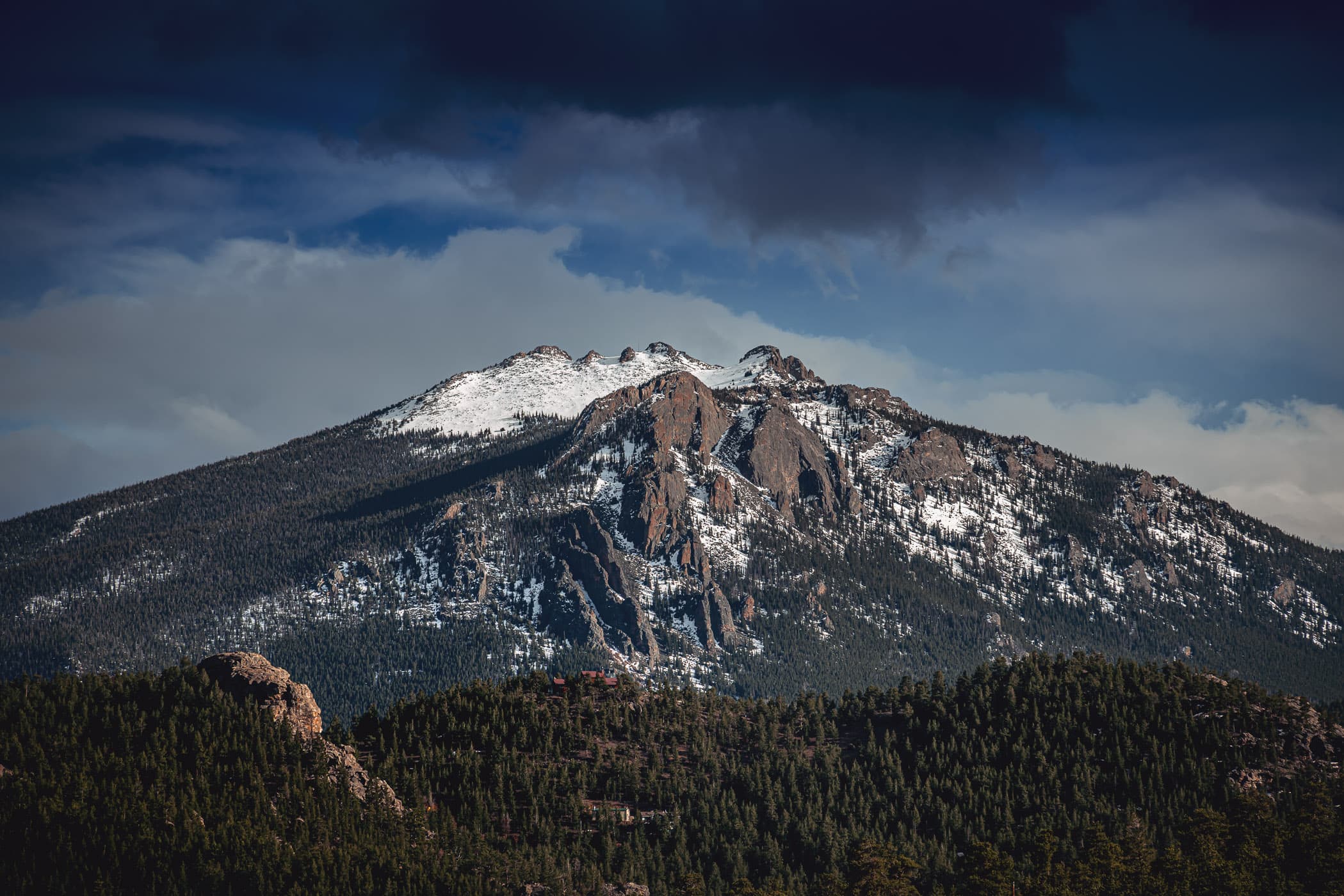A snow-capped, rugged mountain at Colorado's Rocky Mountain National Park.