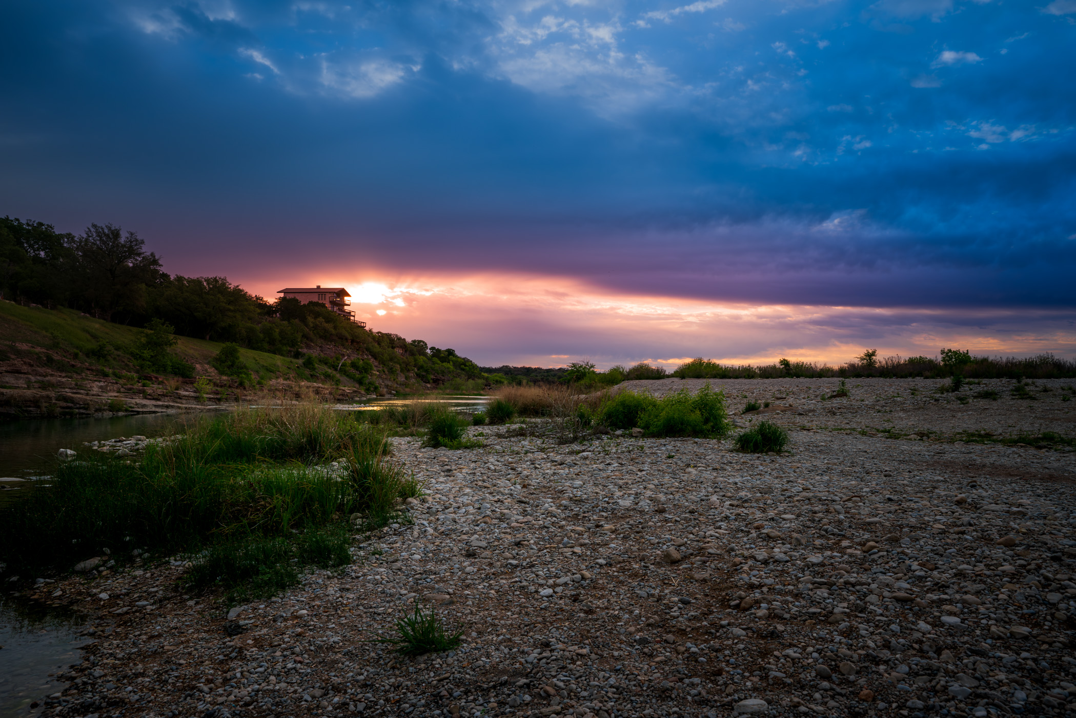 A house overlooks the Llano River near Mason, Texas.