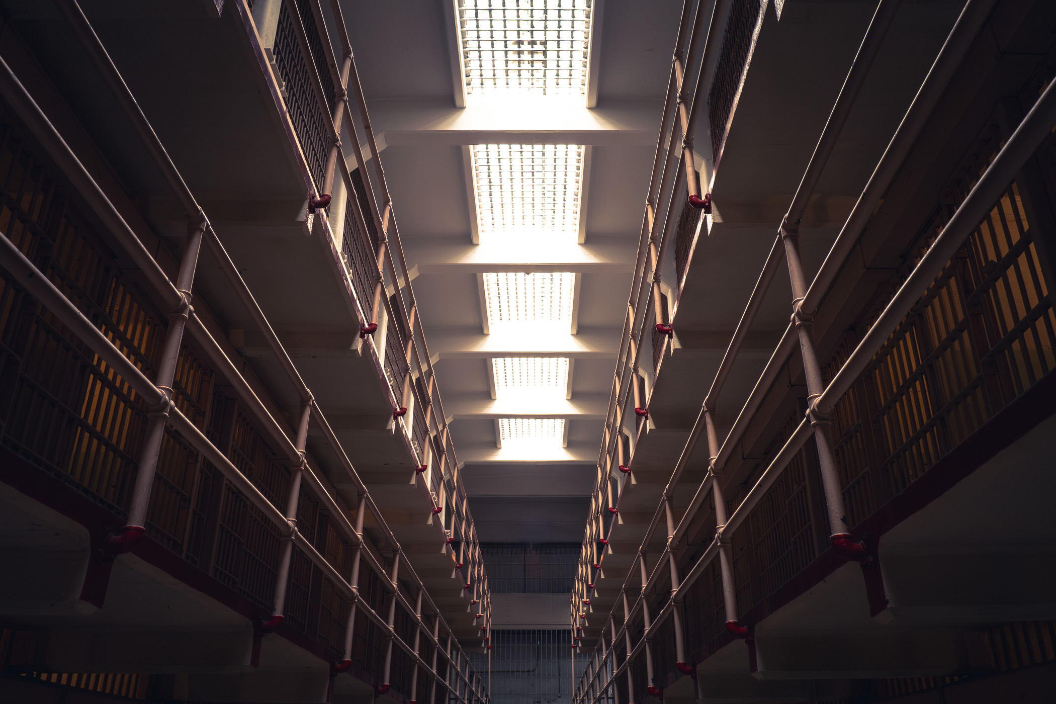 Rows of prison cells in one of the cellblocks at the historic Alcatraz prison, San Francisco.