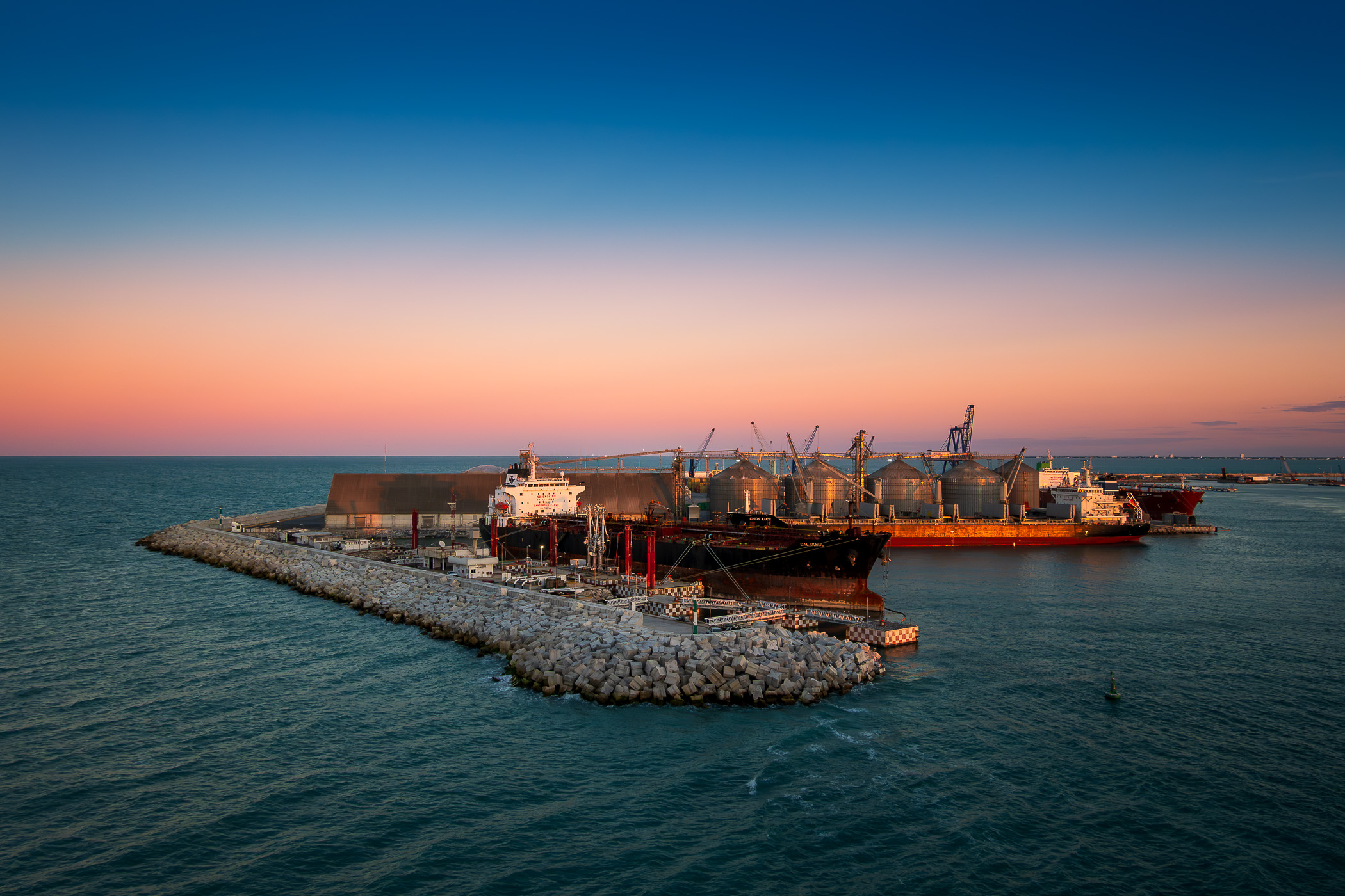 Ships docked at the Terminal Remota—the cargo terminal for the Port of Progreso, Mexico, at the tip of a 6.5-km-long pier that reaches out into the Gulf of Mexico.