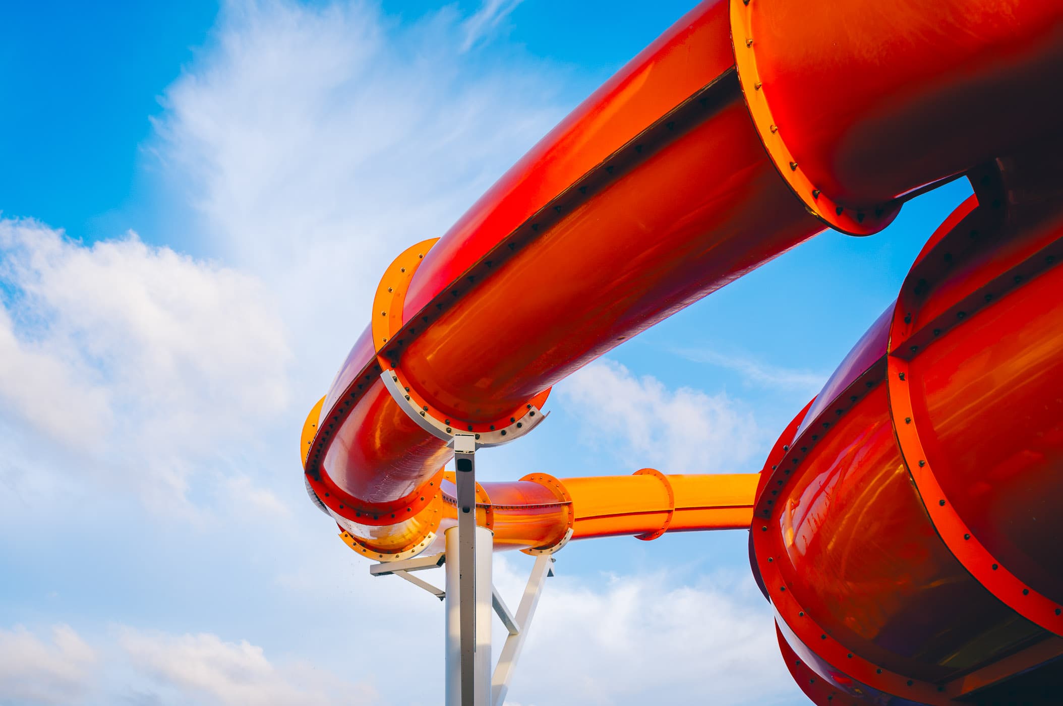 A waterslide on the cruise ship Carnival Magic loops through the sky over the ship somewhere in the Gulf of Mexico.