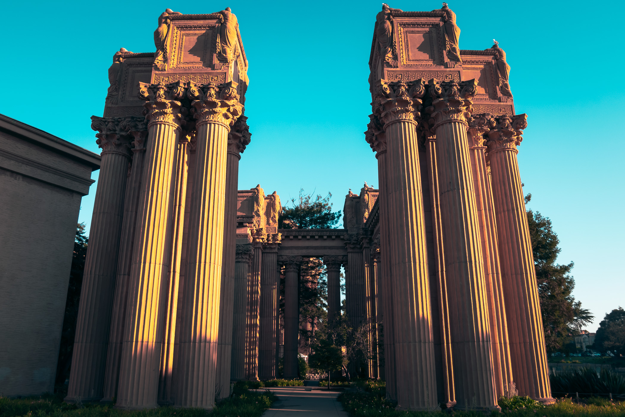 Columns at San Francisco's Palace of Fine Arts catch the early-morning California sun.