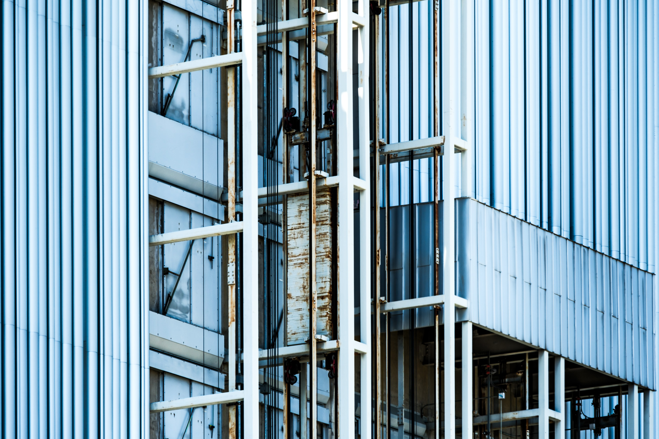 An abstracted view of the exterior elevator mechanisms of the Dee & Charles Wyly Theatre in the Dallas Arts District.