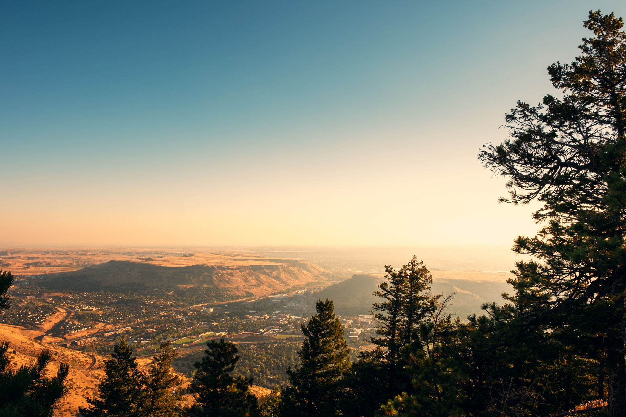 The sun rises on Golden, Colorado, as seen from nearby Lookout Mountain.