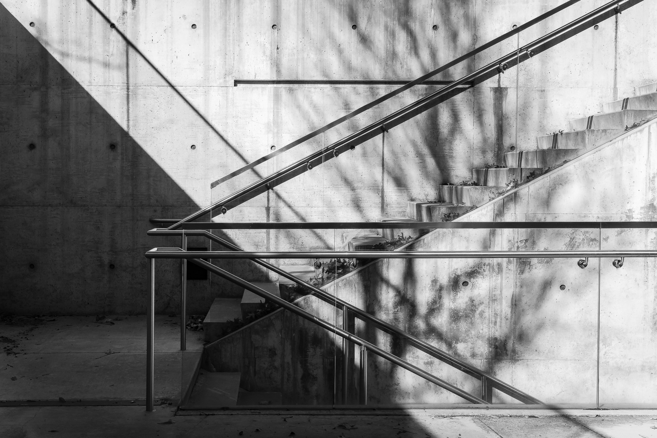Stair railings cast shadows at the Tarrant County College Trinity River Campus in Downtown Fort Worth, Texas.