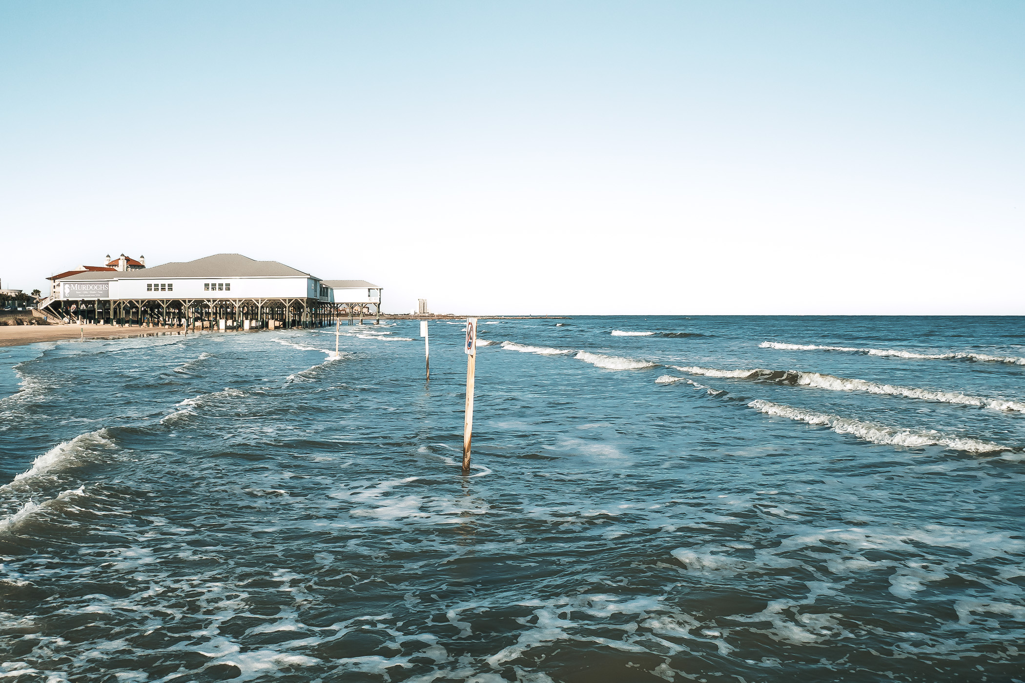 Mid-afternoon waves roll onto on the Galveston, Texas, beach.