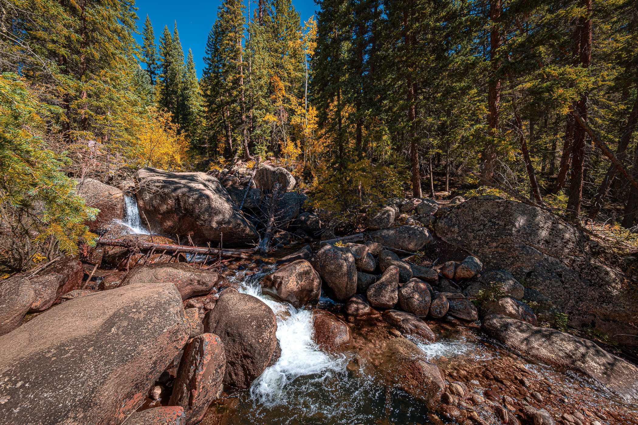 A small waterfall tumbles over boulders at Colorado's Guanella Pass.