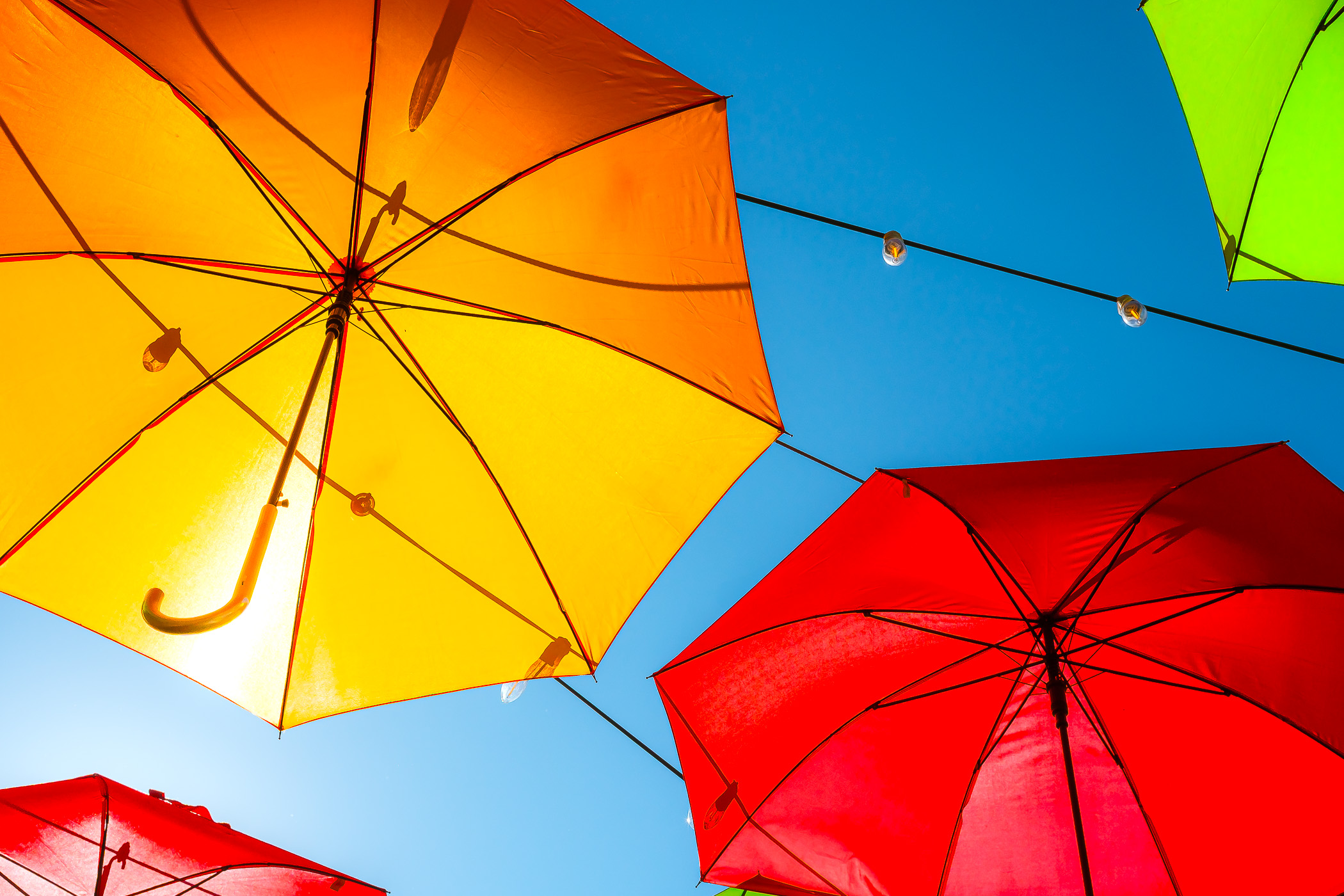 Colorful umbrellas form a public art installation at Allen, Texas' Watters Creek Village.