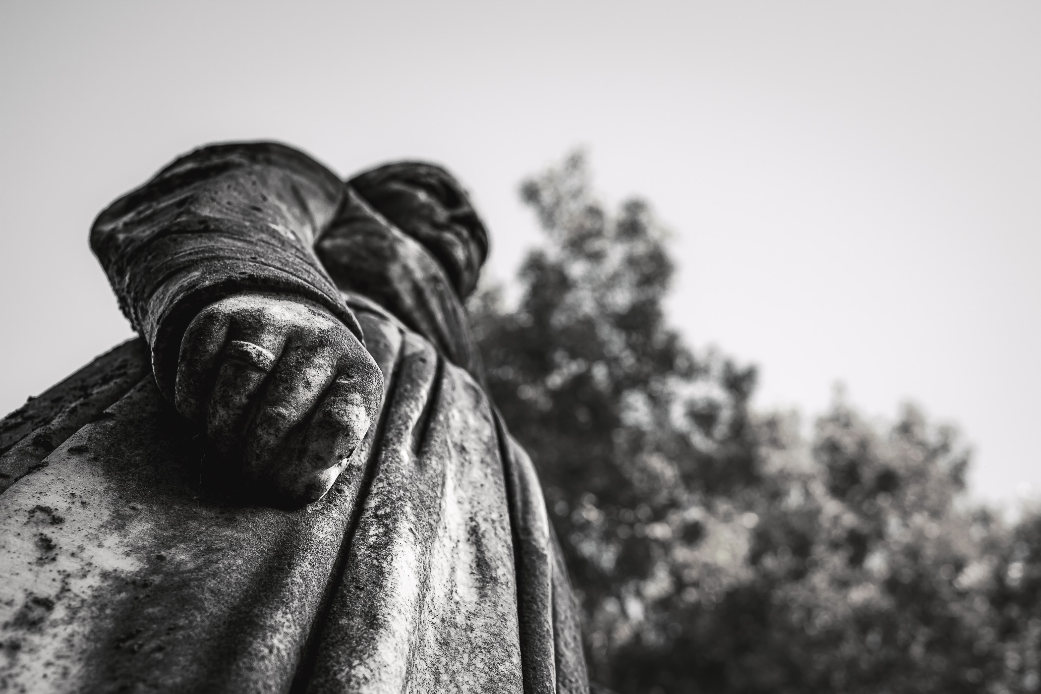 Detail of a statue atop a grave at McKinney, Texas' Pecan Grove Cemetery.